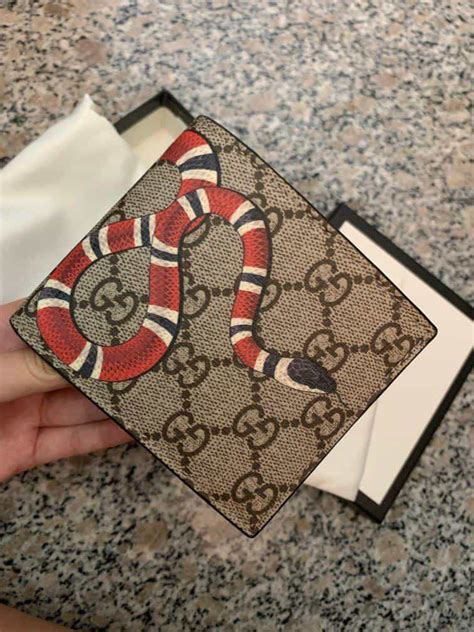 difference between fake gucci wallet and authentic one|authentic gucci snake wallet.